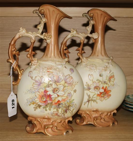 A pair of Continental porcelain ewers, 30cm